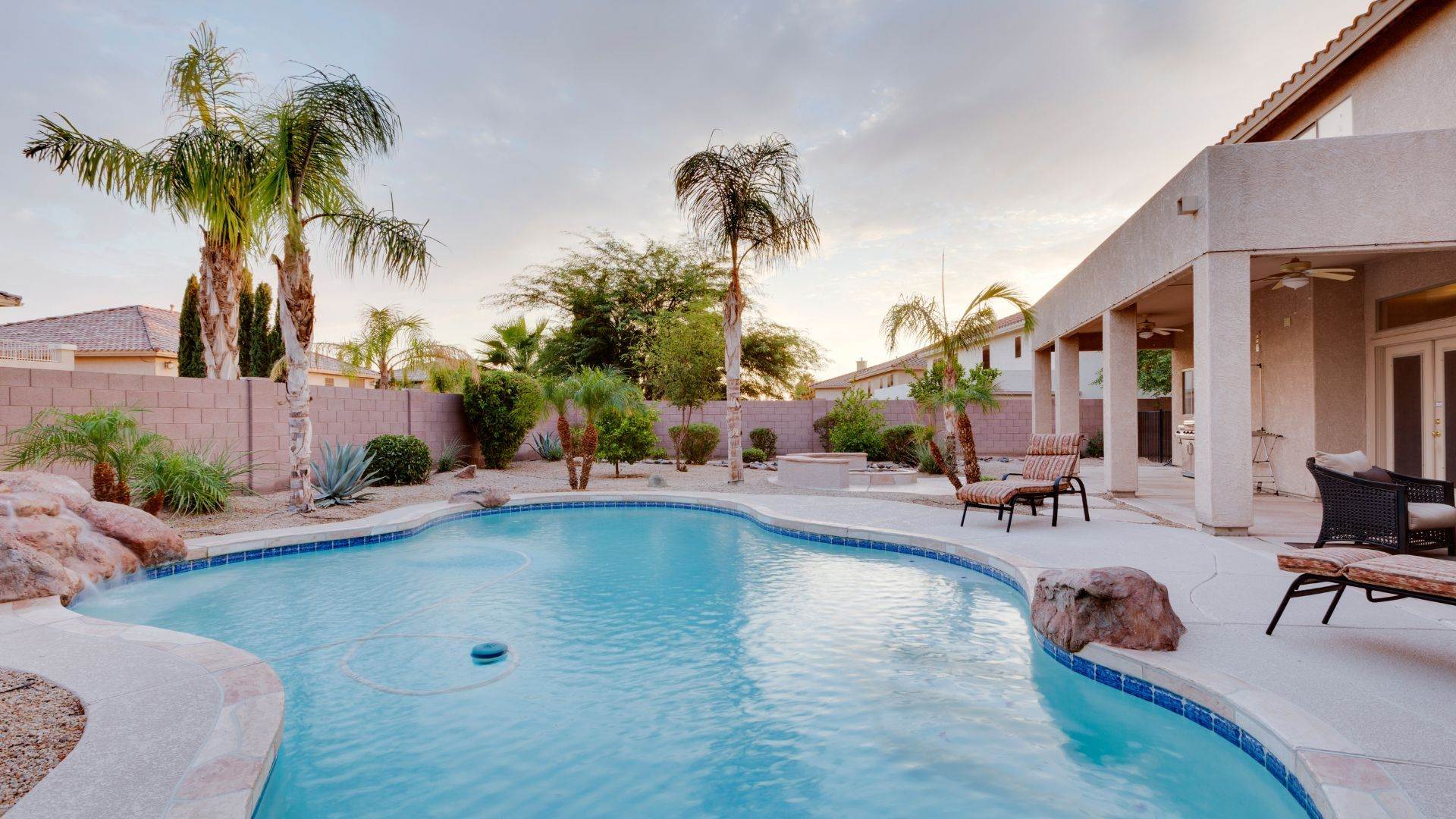 Tolleson, AZ backyard pool with a putting green