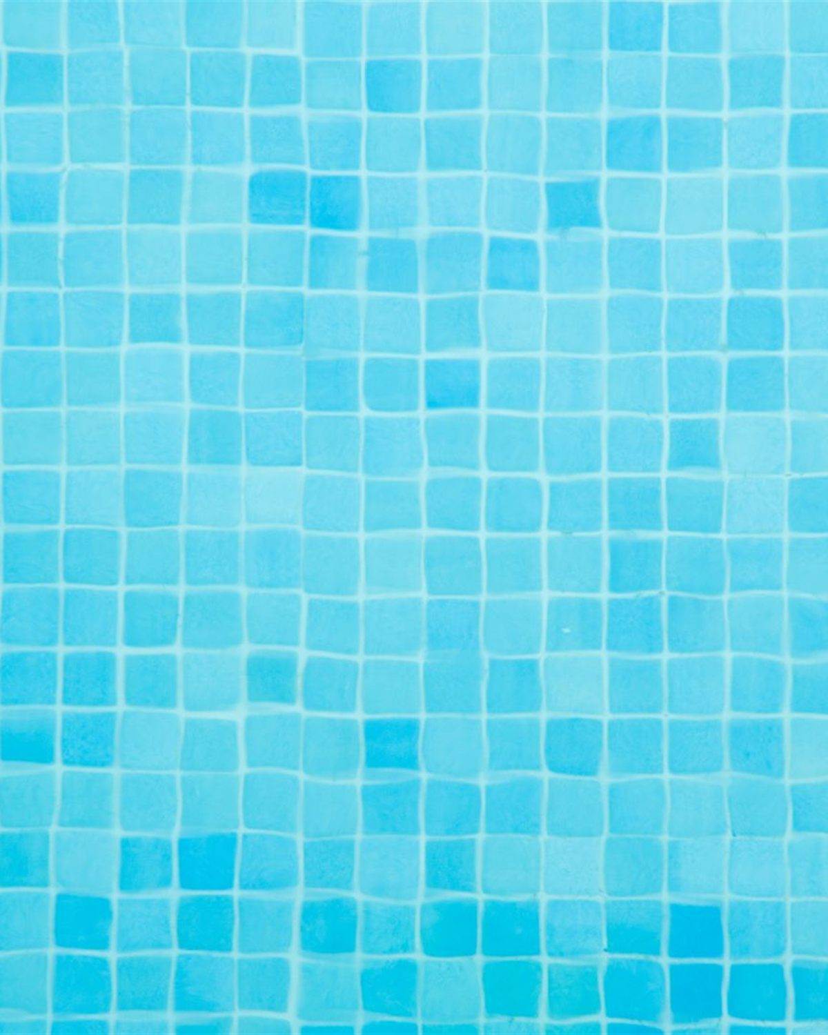 Pale cyan square mosaic pool tile in even light